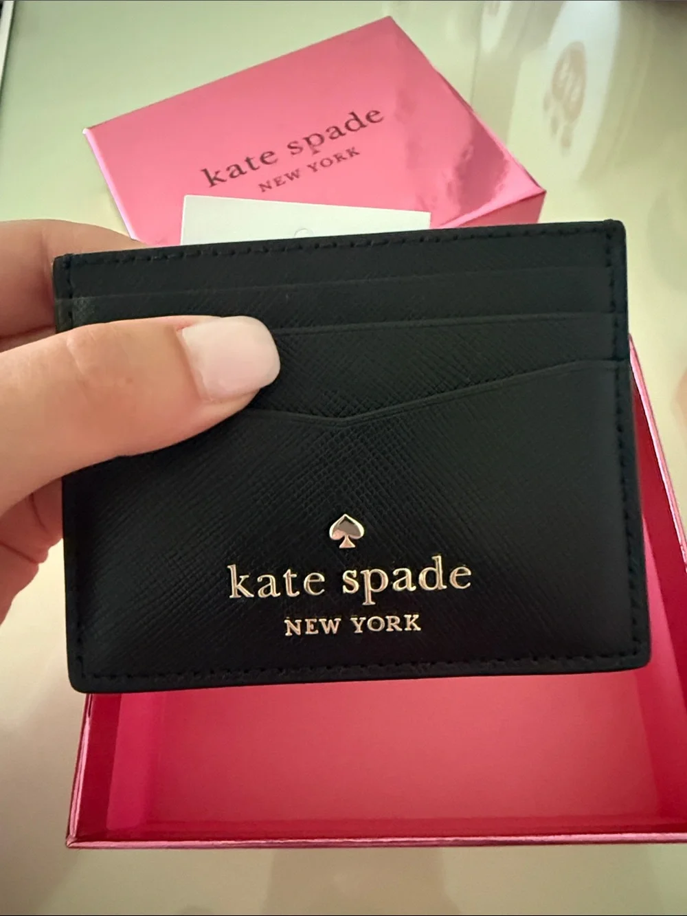 Kate Spade black Saffiano leather card holder with gold logo